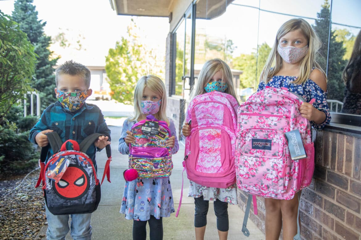 Backpack day children holding backpacks