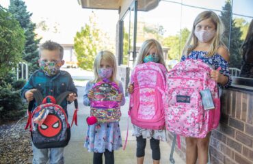 Backpack day children holding backpacks